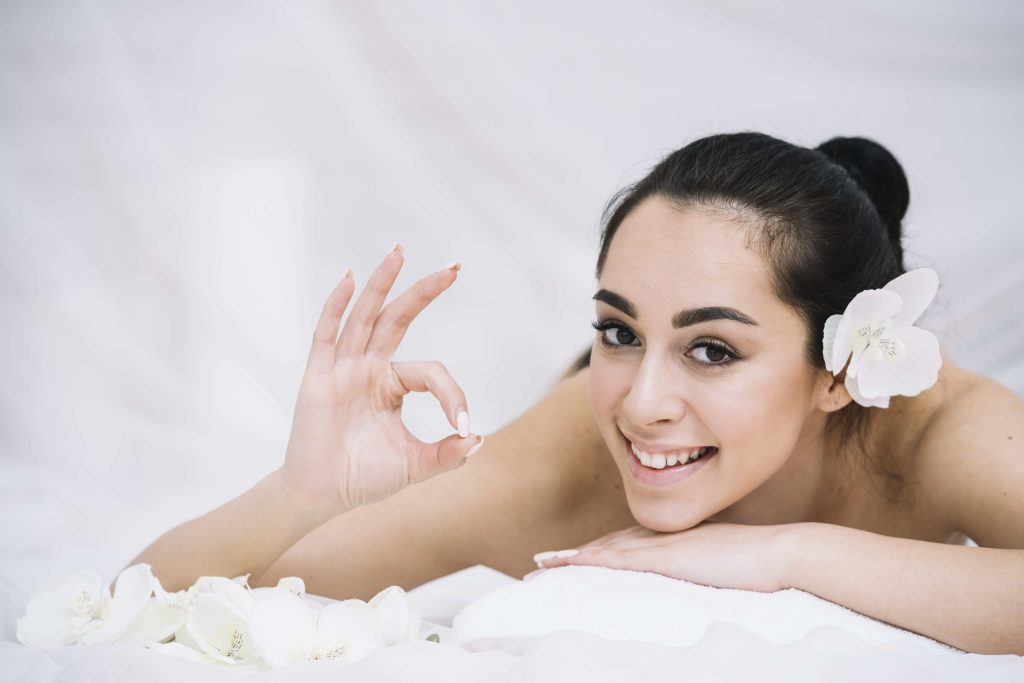 Woman receiving relaxing massage spa 1 1024x683